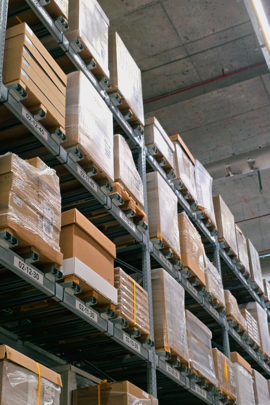 High-bay warehouse racking stocked with equipment